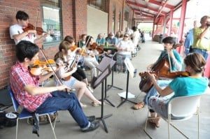 A group learns jazz improv outside